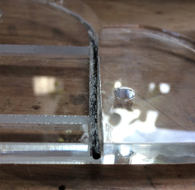 Close up of rubber cord in silicone in a cut groove