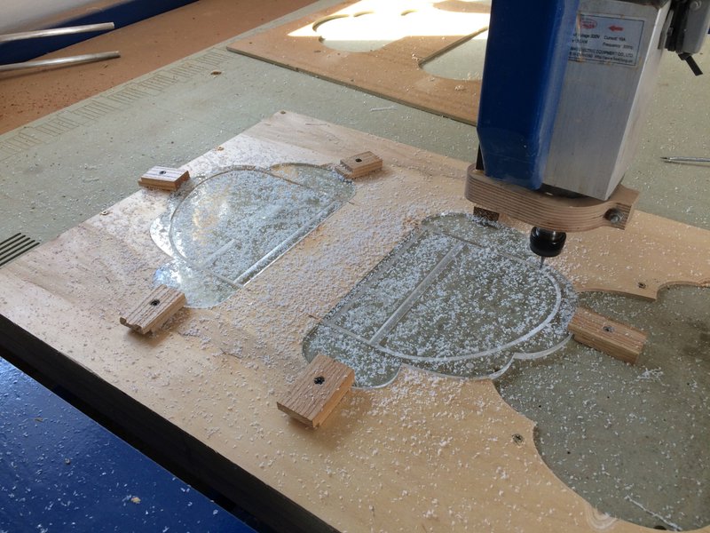 Photo of acrylic being cut, dust everywhere