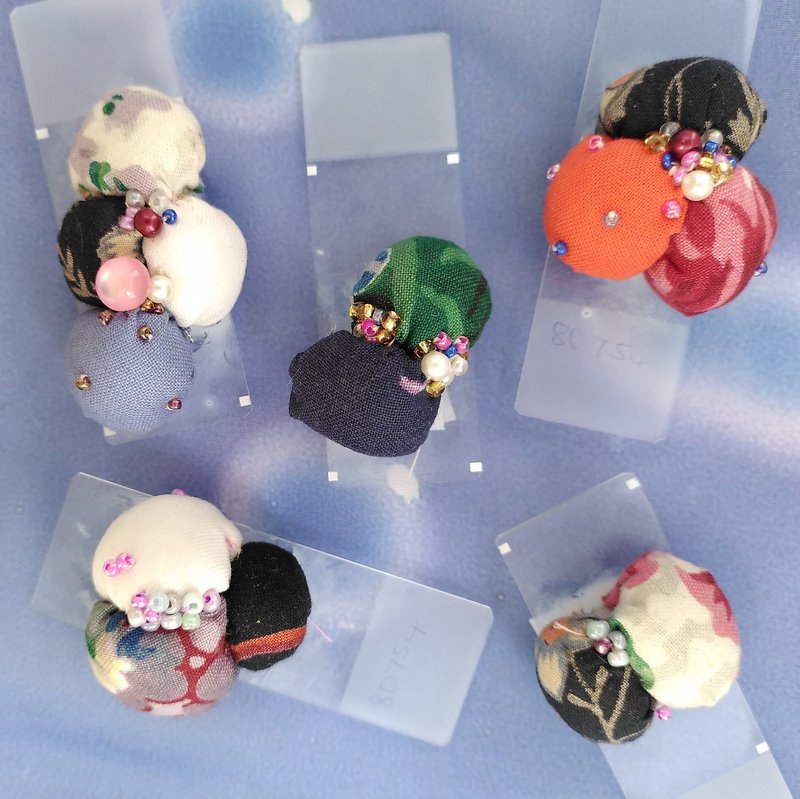 5 glass microscope slides with fabric spheres and beads made to look like microbes on each slide