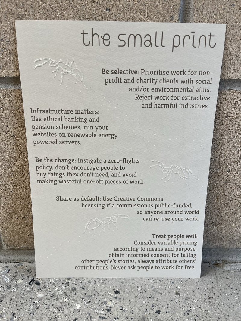 print with 3 embossed ants and their footprints